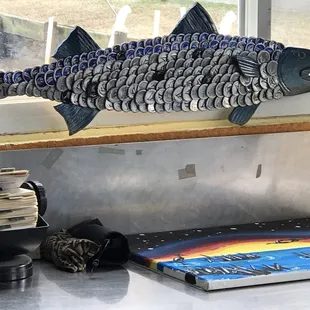 a fish made out of soda cans