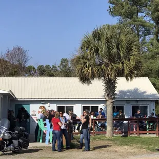 a group of people standing in front of a building