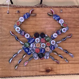 a crab made out of bottle caps