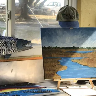 a painting of a fish on a table
