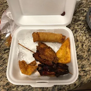 Mixed Appetizers! Egg roll, Krab Rangoon, fried wonton, chicken teriyaki, chicken wing and a rib