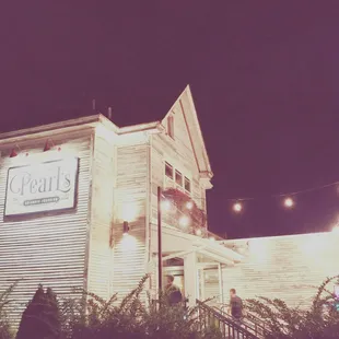 the front of the restaurant at night