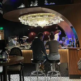 people sitting at the bar