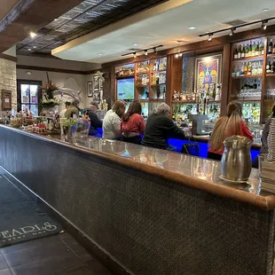 people sitting at the bar