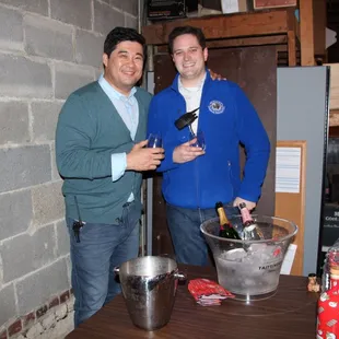 two men holding wine glasses