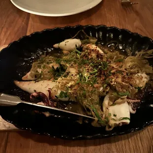 a plate of food on a wooden table