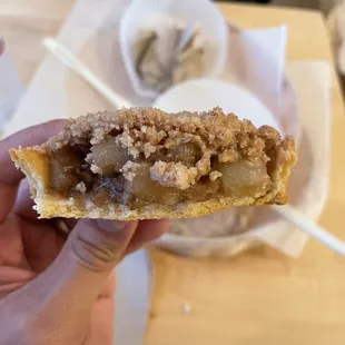 a hand holding a pastry