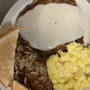 Chicken fried steak breakfast)( served with hash browns or home fries toasted bread or one biscuit with gravy )($15.00)