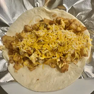 Breakfast burritos ( loaded with potatoes, egg, cheese and your choice of bacon ,sausage,ham or chorizo ($6.00 each)