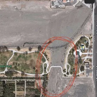 Photo of walkway through the ditch with large rocks and no railing