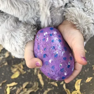 Kindness Rocks&quot; Take one leave one rock garden. My toddler chose this beautiful purple one that reminds me of an Easter Egg!