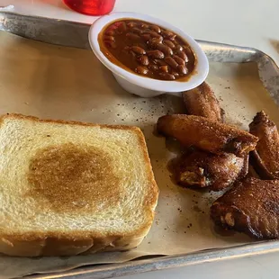 Half wings with baked beans and Texas toast.