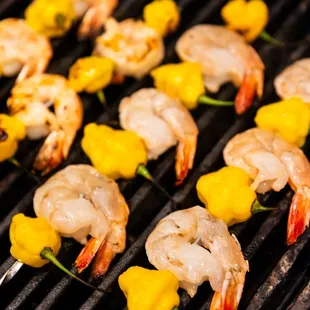 shrimp skewers on a grill