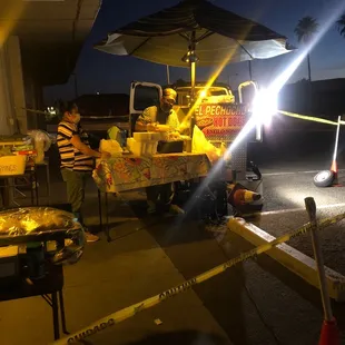 a man selling hotdogs