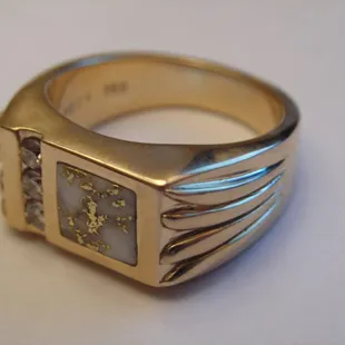 Peck's offers custom made jewelry such as this 18k gents ring with diamonds and gold quartz.