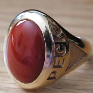 Peck's designed this 18k yellow gold gents ring using Natural Oxblood Coral, weighing almost 1 troy ounce!
