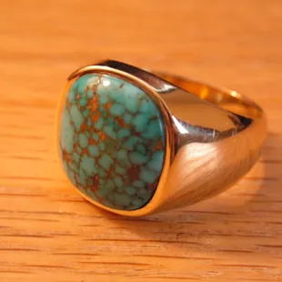 Peck's Designs can create any type of ring you should ever dream of, like this Spiderweb Natural Nevada Turquoise 18k ring.