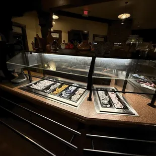 Condiment bar with plasticware and napkins