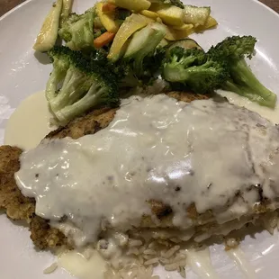 Almond crusted catfish with 1 side dish and salad $16