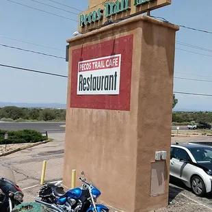 a motorcycle parked in front of a restaurant