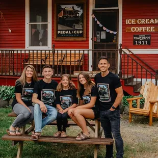 a group of people sitting on a bench