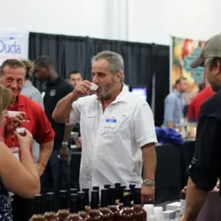 Guests sample Ubons Bloody Mary Mix at our 1st Annual Food Show.