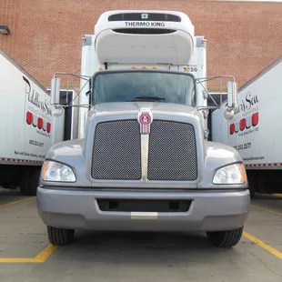 two semi trucks in a parking lot