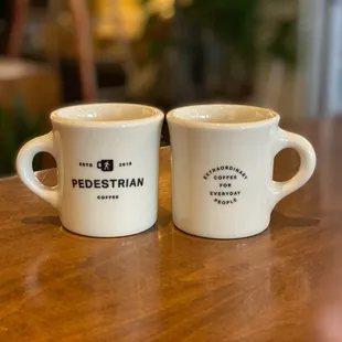 two coffee mugs on a table