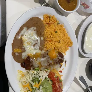 K. 1 Burrito, 1 Chalupa and 1 Beef Taco and 1 Enchilada Combo  They consider the tostada as a chalupa. And the burrito is not pictured.