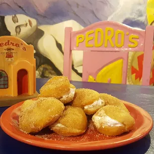 a plate of fried donuts