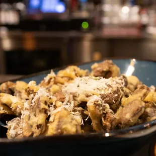 a bowl of pasta with meat and cheese