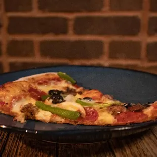 a slice of pizza on a plate