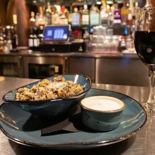 a plate of food and a glass of wine