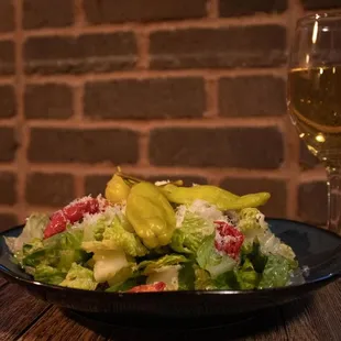 a salad and a glass of wine