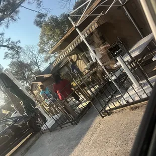 a man and a woman eating outside