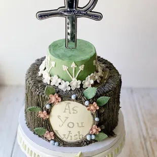 a cake with a sword on top