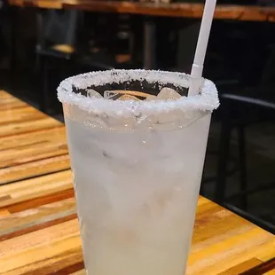 a margarita in a glass with a straw