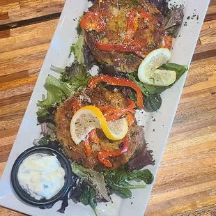 a plate of food on a wooden table