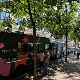 people ordering food from a food truck