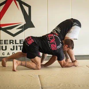 Professor Stephen working on ankle picks from the front head lock.
www.peerlessacademy.com