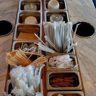 Lots of condiments and tools for your drinks