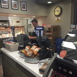 a man working behind a counter