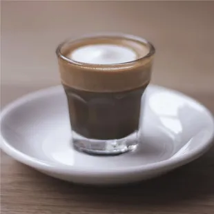 a cup of coffee on a saucer