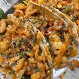 a plate of shrimp tacos