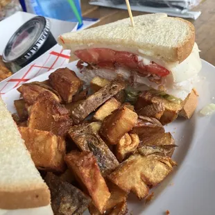 Turkey Club with fried potatoes