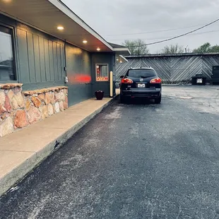 Drive-thru around right side that goes around building.