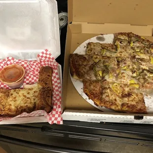a pizza in a box and a pizza in a box