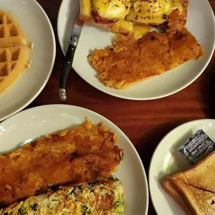 a variety of breakfast foods on plates