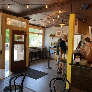 people standing in a coffee shop