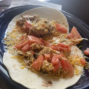 Kids chicken taco, comes with 2! Huge portion. Would love to see 1 taco and pay $6 vs 2 for $10. Ordered with no lettuce.
